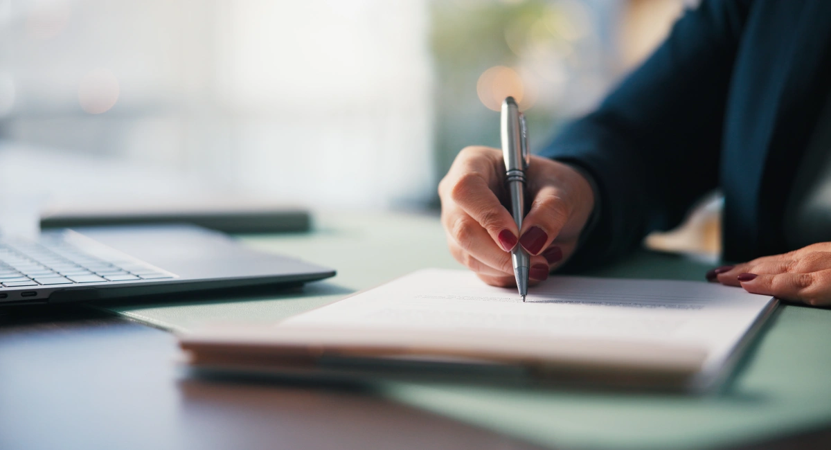 A lady writing a report
