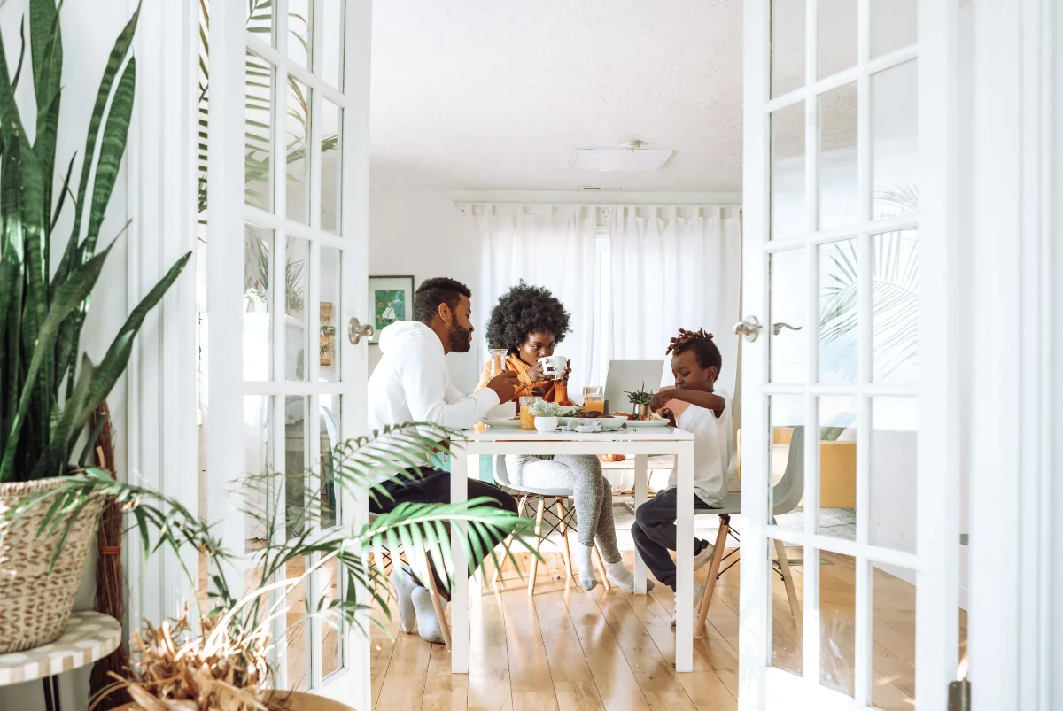 Happy family seated at table