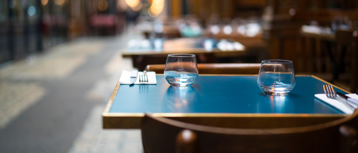 A restaurant table outdoors ready for guests