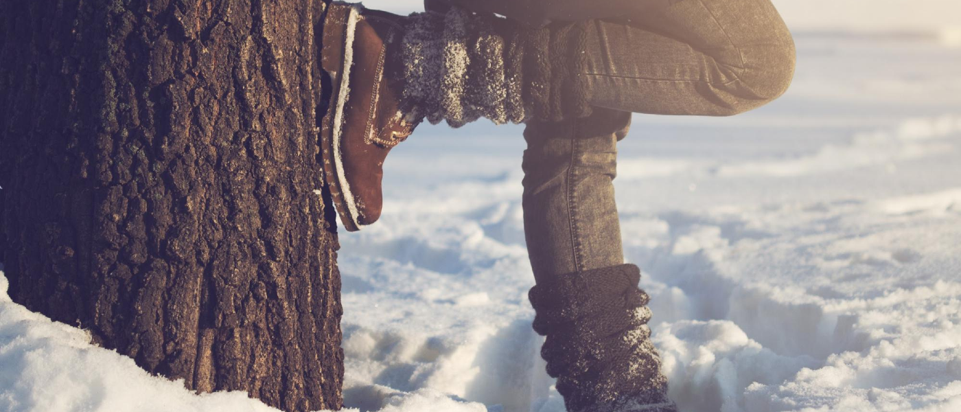 Person standing outside in a field during wintertime