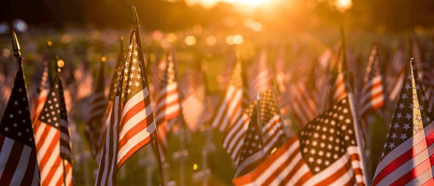 A field of flags at sunset to remember soldiers on Memorial Day.