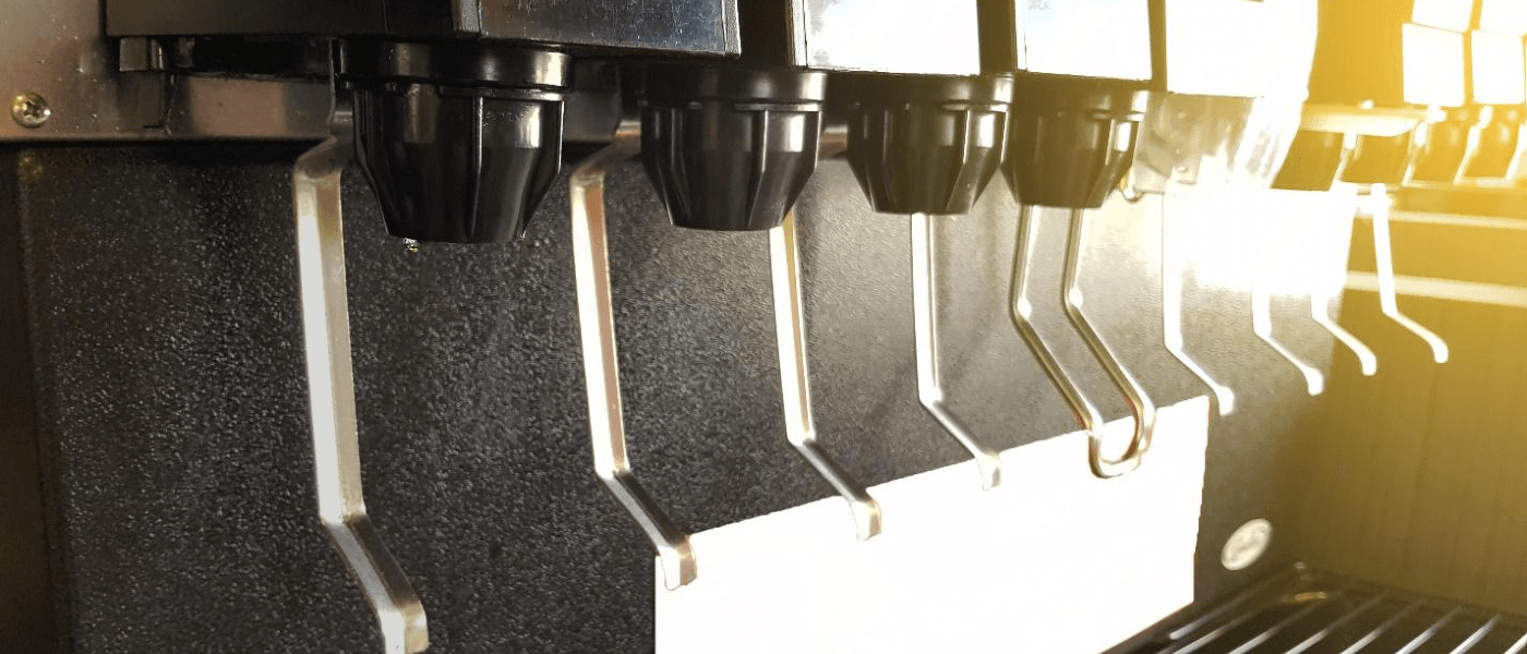 Close up image of a restaurant soda machine