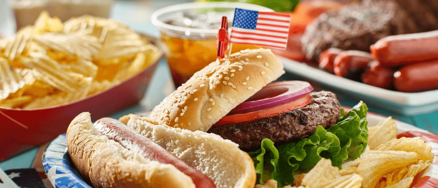 A Fourth of July cookout with hot dogs and hamburgers.