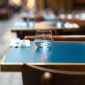 A restaurant table outdoors ready for guests