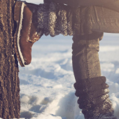 Person standing outside in a field during wintertime