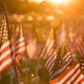 A field of flags at sunset to remember soldiers on Memorial Day.