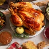 Dinner table arranged with a Thanksgiving feast