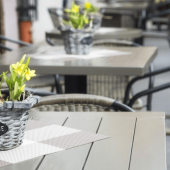 A restaurant patio outdoors, protected from pests.