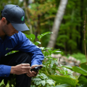 A JP Pest Services team member hard at work protecting a home from outdoor pests.