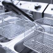 Clean deep frying machines inside a commercial kitchen