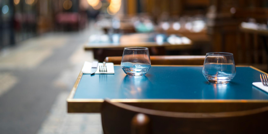 A restaurant table outdoors ready for guests