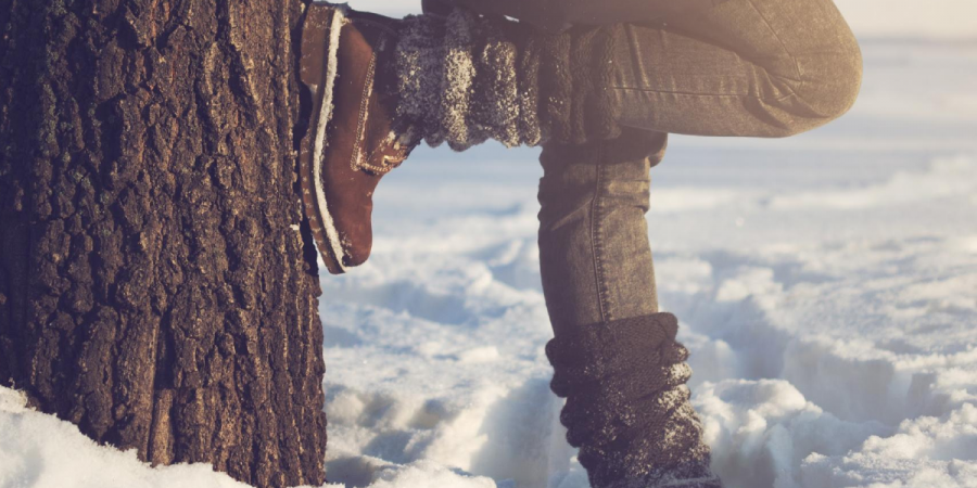 Person standing outside in a field during wintertime