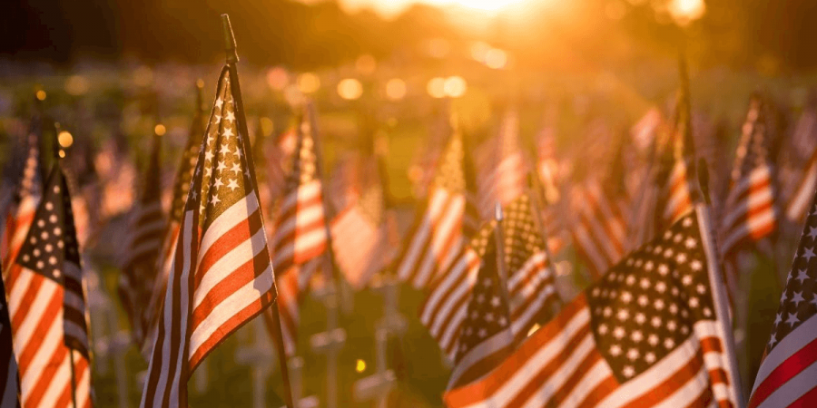 A field of flags at sunset to remember soldiers on Memorial Day.