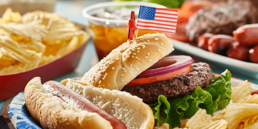 A Fourth of July cookout with hot dogs and hamburgers.