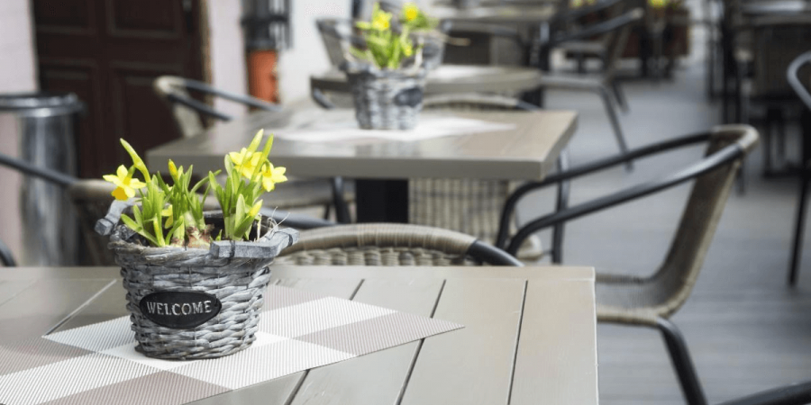 A restaurant patio outdoors, protected from pests.